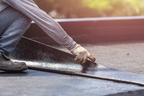 Professional Basement Waterproofing technician working in Fayetteville, AL